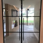 Fireproof frameless door with glass to a business center – photo, specifications, price